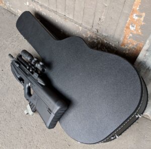Cedar Mill Firearms discreet concealment guitar-shaped rifle case with a gun