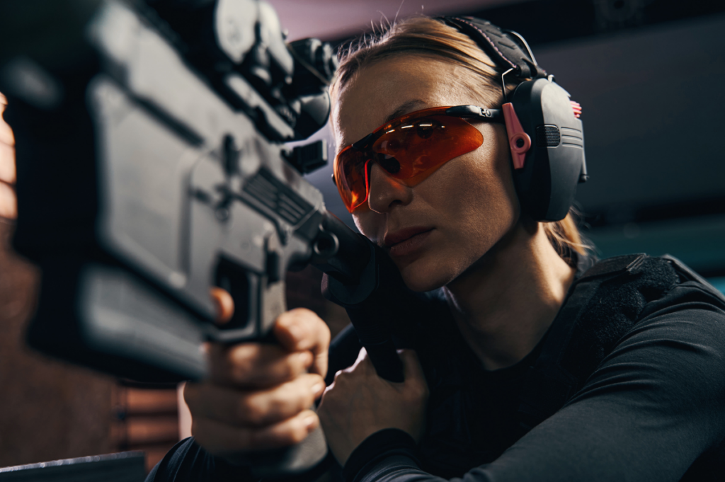 female aiming AR15