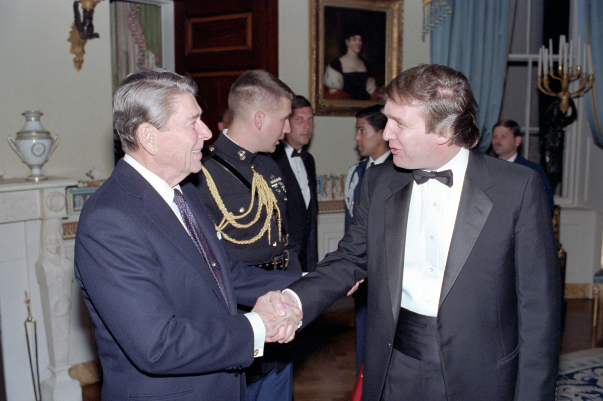 Donald Trump shaking hands with President Reagan